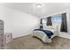 Bright bedroom featuring carpet, a window with curtains, and a chest of drawers at 8044 N 10Th Pl, Phoenix, AZ 85020