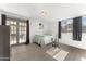 Cozy bedroom with tiled floors, bright natural light, glass doors leading to patio at 8044 N 10Th Pl, Phoenix, AZ 85020