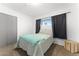 Bedroom with carpet, a window with black curtains, and a closet to the left at 8044 N 10Th Pl, Phoenix, AZ 85020