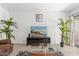 Bright living room showcasing a TV and views to the backyard with tiled flooring at 8044 N 10Th Pl, Phoenix, AZ 85020