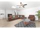 Inviting living room showcasing tile floors, comfortable seating, and a cozy fireplace at 8044 N 10Th Pl, Phoenix, AZ 85020