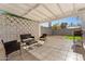 A cozy covered patio with outdoor seating, offering a relaxed atmosphere for entertaining and enjoying the outdoors at 8044 N 10Th Pl, Phoenix, AZ 85020