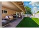 Outdoor patio with grill, seating, and adjacent pool area, ideal for summer gatherings and relaxation at 8338 E Monterosa St, Scottsdale, AZ 85251