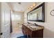 Well-lit bathroom features a double sink vanity with granite countertop, a large mirror and a separate toilet room at 8338 E Monterosa St, Scottsdale, AZ 85251