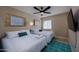 Bright bedroom boasts two full beds with fresh linens, a ceiling fan, and contemporary decor with ample natural light at 8338 E Monterosa St, Scottsdale, AZ 85251
