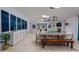 Open-concept dining and living area with stylish furniture, modern art, and abundant natural light from skylights at 8338 E Monterosa St, Scottsdale, AZ 85251