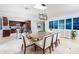 Bright dining room with stylish table and chairs, skylights, and seamless flow to the kitchen at 8338 E Monterosa St, Scottsdale, AZ 85251