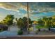 Charming single-story home featuring a two-car garage and mature trees in a well-maintained front yard at 8338 E Monterosa St, Scottsdale, AZ 85251