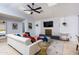 Comfortable living room features a plush white sofa, modern decor, and skylights, creating a bright and inviting space at 8338 E Monterosa St, Scottsdale, AZ 85251
