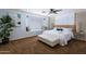 Comfortable bedroom with a window seat, decorative headboard, and a ceiling fan at 8338 E Monterosa St, Scottsdale, AZ 85251