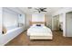 Bright bedroom featuring a window seat, geometric headboard and mirrored closet doors at 8338 E Monterosa St, Scottsdale, AZ 85251