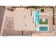 Birds eye view of the house with a pool, patio, and landscaped areas, nestled in a residential neighborhood at 8444 E Piccadilly Rd, Scottsdale, AZ 85251