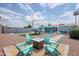 Relaxing backyard area with a fire pit, comfortable seating, and a view of the pool at 8444 E Piccadilly Rd, Scottsdale, AZ 85251