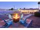Enjoy this resort-style backyard with a pool, fire pit, and outdoor lounge areas at 8444 E Piccadilly Rd, Scottsdale, AZ 85251