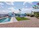 Inviting backyard featuring a refreshing pool, lounge area, and covered patio with outdoor seating at 8444 E Piccadilly Rd, Scottsdale, AZ 85251