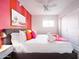 Stylish bedroom featuring bright and colorful decor, a comfortable bed, and a ceiling fan at 8444 E Piccadilly Rd, Scottsdale, AZ 85251