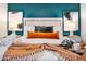 Cozy bedroom with warm tones, decorative pillows, and side tables at 8444 E Piccadilly Rd, Scottsdale, AZ 85251