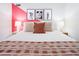 Bright bedroom featuring a cozy bed with decorative pillows and a patterned throw blanket at 8444 E Piccadilly Rd, Scottsdale, AZ 85251