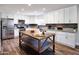 Bright kitchen with stainless steel appliances, granite countertops, wooden island, and modern cabinetry at 8444 E Piccadilly Rd, Scottsdale, AZ 85251