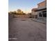 A spacious backyard featuring dirt for custom landscaping and creating an outdoor living space at 9108 W Kirby Ave, Tolleson, AZ 85353