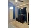 Bedroom featuring a ceiling fan, window with dark curtains, and a dresser with a wall-mounted TV at 9108 W Kirby Ave, Tolleson, AZ 85353