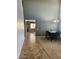 View of dining room with high ceilings and stylish chandelier next to a hallway with tile flooring at 9108 W Kirby Ave, Tolleson, AZ 85353
