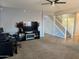 Inviting living room showcasing an entertainment center, and a staircase leading to the upper level at 9108 W Kirby Ave, Tolleson, AZ 85353