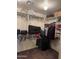 A walk-in closet provides ample storage with shelves, rods, and room for organizing belongings efficiently at 9108 W Kirby Ave, Tolleson, AZ 85353