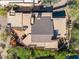 An aerial view showcasing the property's layout, desert landscape, and private outdoor pool area at 9998 E Taos Dr, Scottsdale, AZ 85262