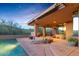Expansive backyard features a pool, patio, desert landscaping, and comfortable lounging space at 9998 E Taos Dr, Scottsdale, AZ 85262
