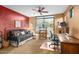 Cozy bedroom with a comfortable daybed, stylish decor, and views of the backyard at 9998 E Taos Dr, Scottsdale, AZ 85262