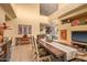 Open-concept dining room with a hardwood table and view of breakfast nook and kitchen at 9998 E Taos Dr, Scottsdale, AZ 85262