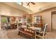 A dining room and breakfast nook area with hardwood floors and custom bench and chair seating at 9998 E Taos Dr, Scottsdale, AZ 85262
