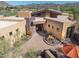 Attractive desert home featuring a stone accent wall and decorative desert landscaping at 9998 E Taos Dr, Scottsdale, AZ 85262