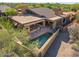 Stylish desert home featuring a covered patio, pool, and easy access to scenic outdoor living spaces at 9998 E Taos Dr, Scottsdale, AZ 85262
