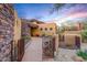 Beautiful home with desert landscaping and sunset sky at 9998 E Taos Dr, Scottsdale, AZ 85262