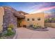 Beautiful desert home featuring a desert garden and warm color tones at 9998 E Taos Dr, Scottsdale, AZ 85262