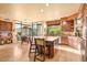 Spacious kitchen with large center island, barstool seating, and views of the surrounding landscape at 9998 E Taos Dr, Scottsdale, AZ 85262