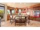 Modern kitchen with center island, granite counters, ample cabinetry, and view of the outdoor landscape at 9998 E Taos Dr, Scottsdale, AZ 85262