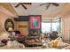 Cozy living room featuring a fireplace, wood ceiling, and comfortable seating for relaxation at 9998 E Taos Dr, Scottsdale, AZ 85262