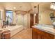 A spacious main bathroom features tile floors, a soaking tub, and glass shower enclosure at 9998 E Taos Dr, Scottsdale, AZ 85262