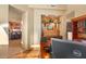 Office featuring decorative shelves, a desk, and views of other rooms in the house at 9998 E Taos Dr, Scottsdale, AZ 85262