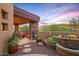 Relaxing outdoor patio featuring desert flora, comfortable seating, and a serene desert ambiance at 9998 E Taos Dr, Scottsdale, AZ 85262