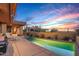 Relaxing pool area with lounge chair, landscaping, and peaceful desert atmosphere provides a private oasis at 9998 E Taos Dr, Scottsdale, AZ 85262