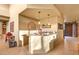 Elegant wet bar featuring granite countertops, sink, and convenient access to other areas of the home at 9998 E Taos Dr, Scottsdale, AZ 85262