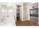 Bright bathroom featuring double sinks, walk-in shower, and walk-in closet at 1210 W Agrarian Hills Dr, San Tan Valley, AZ 85143