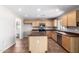 Well-lit kitchen featuring tile flooring and an island with stainless steel appliances at 1210 W Agrarian Hills Dr, San Tan Valley, AZ 85143