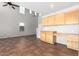 Bright living room featuring tile flooring and a built-in desk area at 1210 W Agrarian Hills Dr, San Tan Valley, AZ 85143