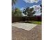 The backyard has a nice stone patio and some green lawn, as well as some beautiful plants to add color to the property at 3229 W Five Mile Peak Dr, San Tan Valley, AZ 85144