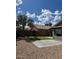 Picturesque backyard featuring desert landscaping, an artificial lawn, and mature palm trees at 3229 W Five Mile Peak Dr, San Tan Valley, AZ 85144